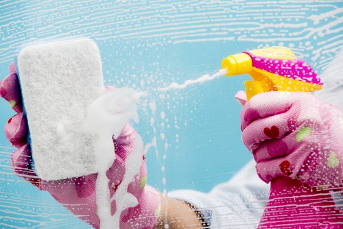 Cleaning staff sanitizing high-touch areas in a business environment